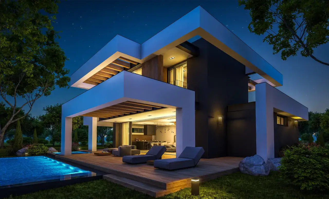 Nowoczesny dom z basenem i tarasem, oświetlenie elewacji domu od dołu podkreśla architekturę.