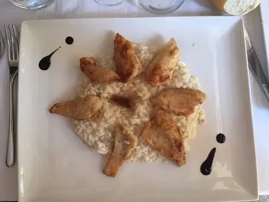 Varenna jedzenie nad jeziorem Como risotto pesce persico