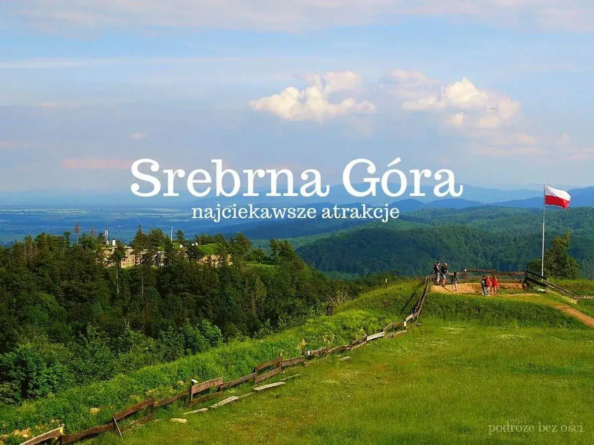 Srebrna G&oacute;ra zaprasza! Malowniczy krajobraz, zielone wzg&oacute;rza i polska flaga. Odkryj najciekawsze atrakcje tego miejsca.
