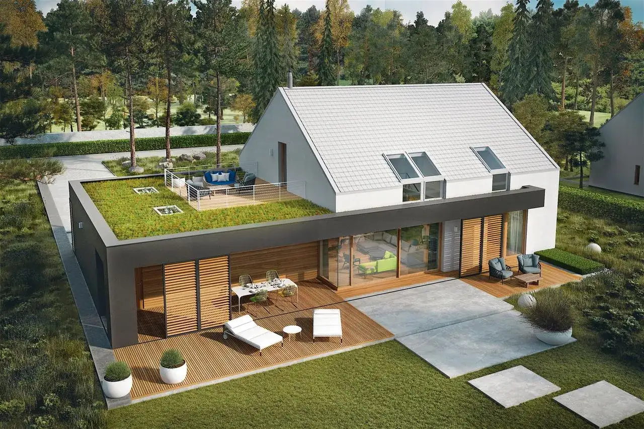 Nowoczesna stodoła z zielonym dachem i tarasem, otoczona drzewami. Wygodne meble wypoczynkowe zapraszają do relaksu.