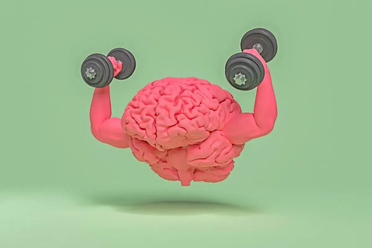 Różowy mózg z muskularnymi ramionami podnosi ciężarki. Siła umysłu, która może pokonać nawet efekt placebo.