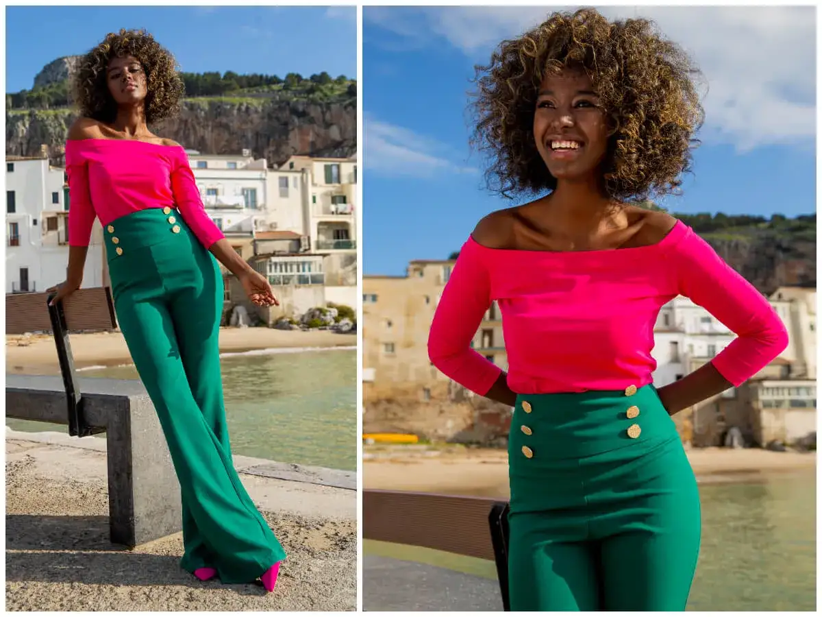 Modelka w stylizacji inspirowanej tym, jak wyglądają hiszpanki: fuksjowy top hiszpanka i zielone spodnie z wysokim stanem.