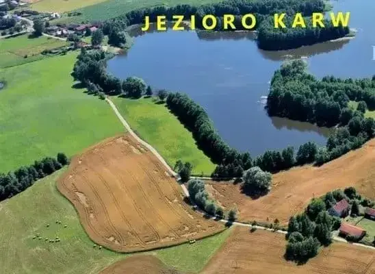 Zdjęcie Działka nad jeziorem z linią brzegową w warmińsko-mazurskim – idealna inwestycja