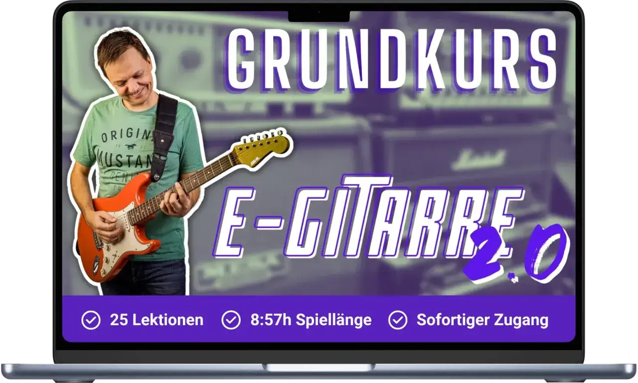 Mann spielt orange E-Gitarre, "GRUNDKURS E-GITARRE 2.0" steht im Bild.