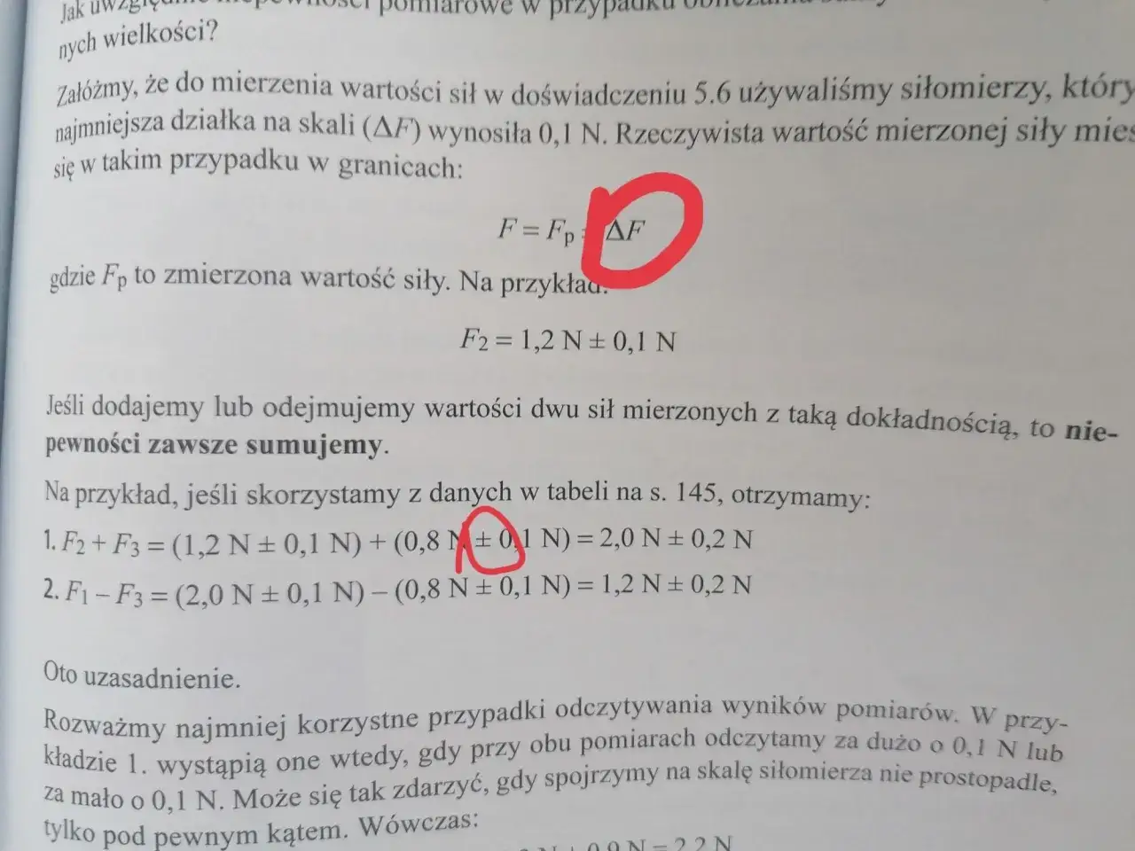 Fragment tekstu z fizyki z zaznaczonym symbolem ΔF i równaniami.