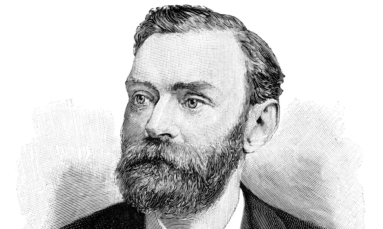 Portret Alfreda Nobla w stylu drzeworytu, z charakterystyczną brodą i wąsami.