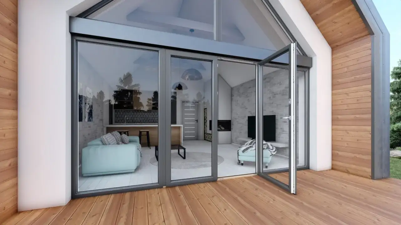 Nowoczesne drzwi tarasowe otwierane na zewnątrz, z widokiem na przytulne wnętrze z kanapą i kominkiem.