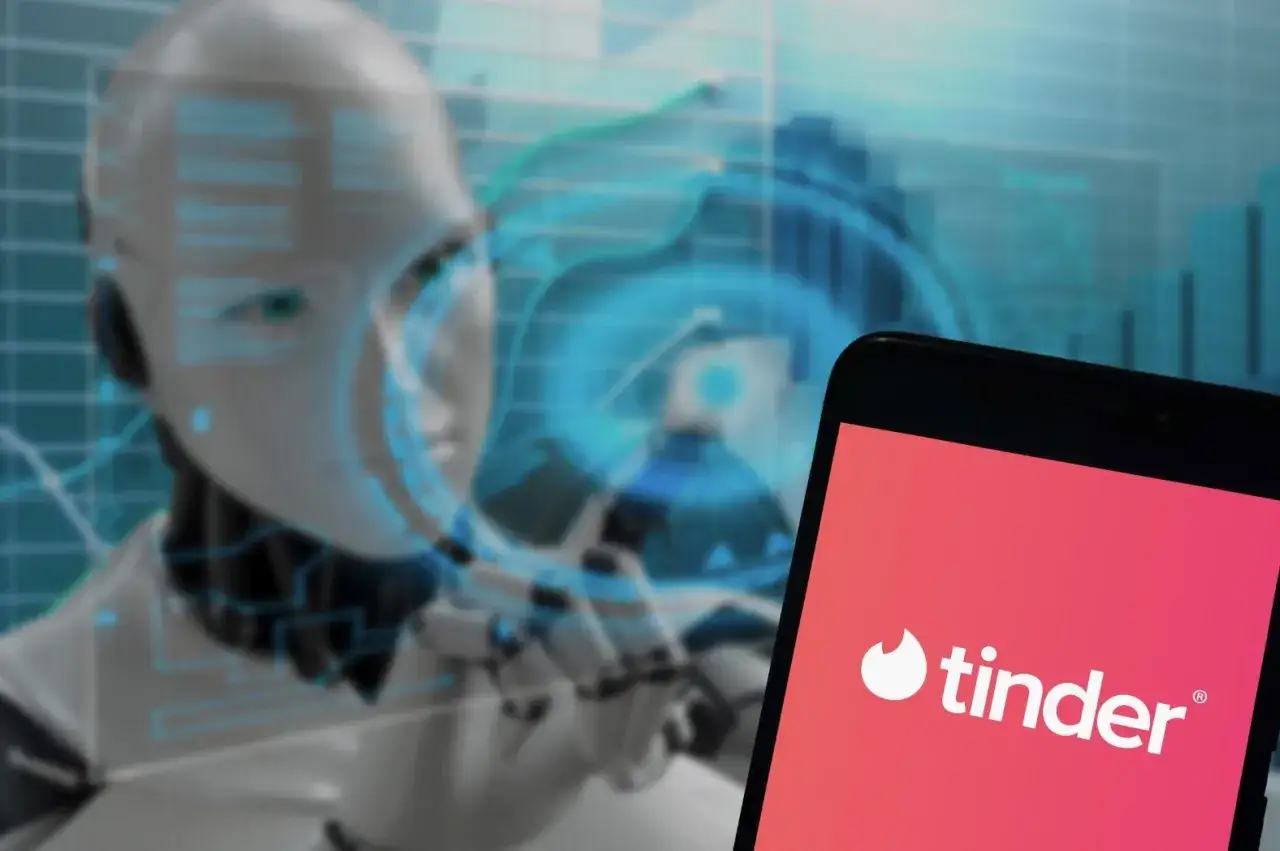 Robot analizujący dane, obok ekran telefonu z logo Tinder. Czy to przyszłość randek dla intj?