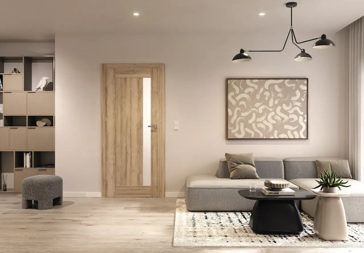 Drewniane drzwi z przeszkleniem w nowoczesnym salonie z sofą i stolikiem.