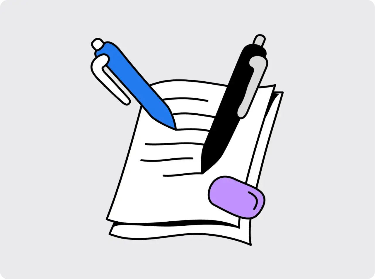 Dwa długopisy nad stosem papieru z gumką.