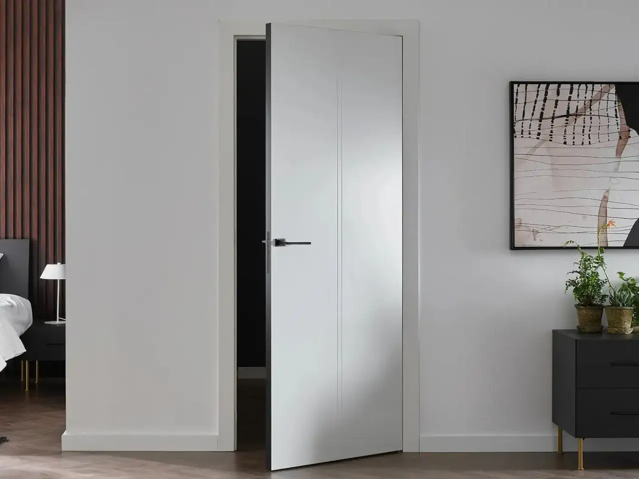 Nowoczesne białe drzwi wewnętrzne aranżacje. Minimalistyczny design, czarna klamka, stylowy dodatek do wnętrza.