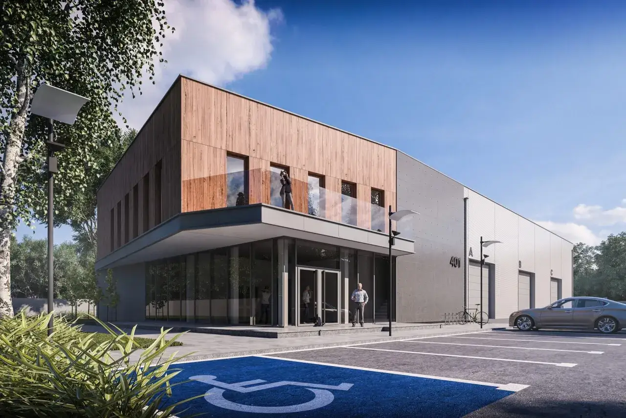 Nowoczesny budynek biurowy projekt z drewnianą elewacją i betonem. Przed budynkiem parking z miejscem dla niepełnosprawnych.