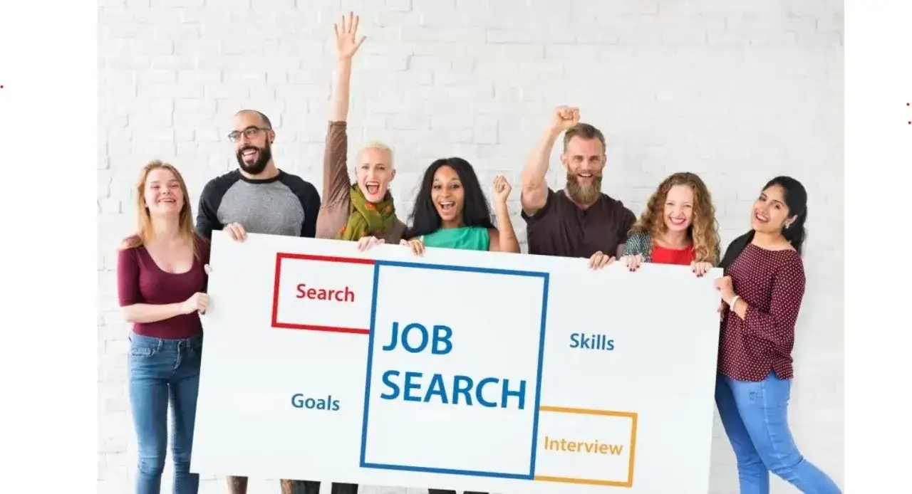 Grupa ludzi trzyma tablicę z napisem "JOB SEARCH", symbolizującą poszukiwanie pracy i najbardziej poszukiwane zawody w Polsce.