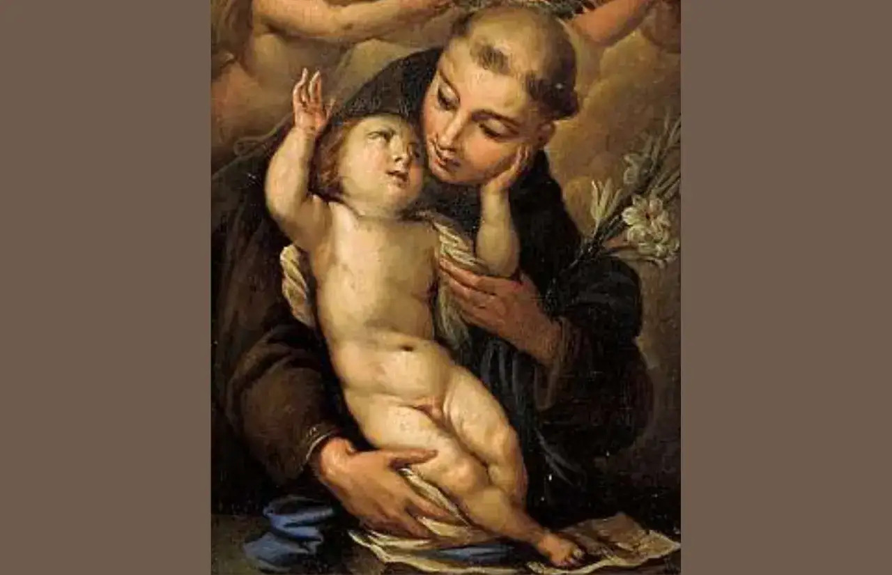 Święty Antoni z Dzieciątkiem Jezus na rękach, z lilią w dłoni.