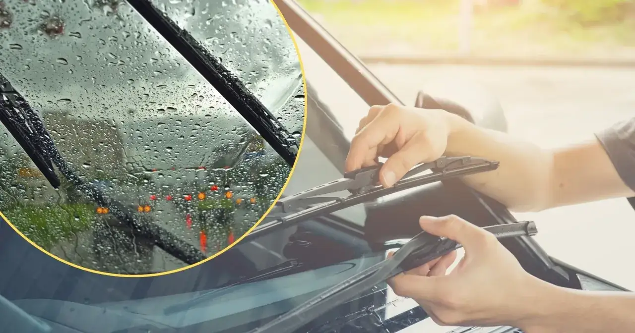 Deszcz na szybie i ręce wymieniające wycieraczki. Upewnij się, że masz płyn, by uniknąć mandatu za brak płynu do spryskiwaczy.