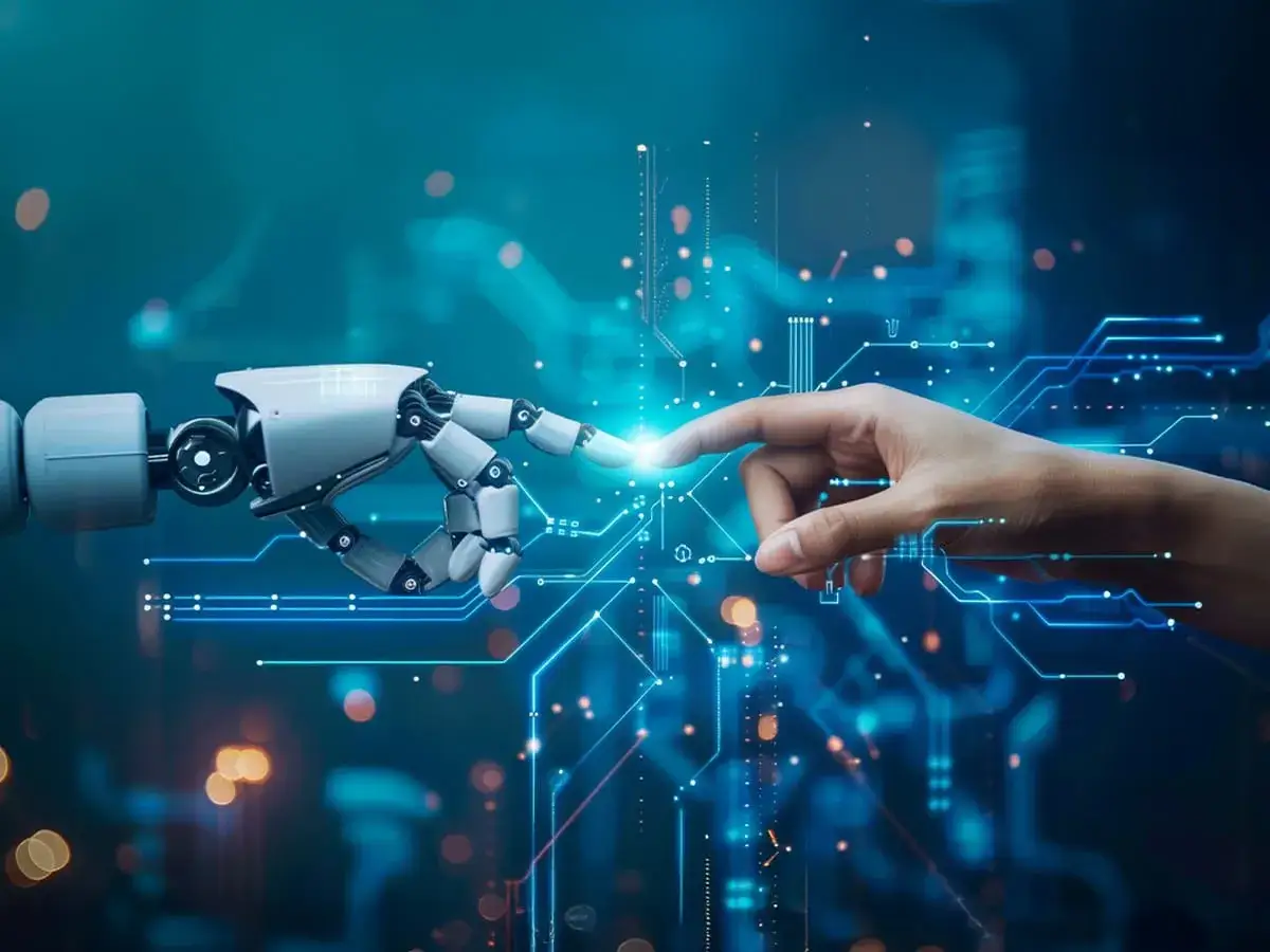 Dłoń człowieka i robotyczna ręka dotykają się na tle niebieskich obwodów.
