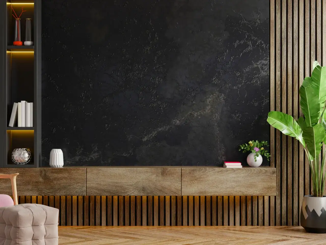 Nowoczesne wnętrze z czarnym, strukturalnym tynkiem na ścianie. Inspiracja, jak samemu położyć tynk dekoracyjny.