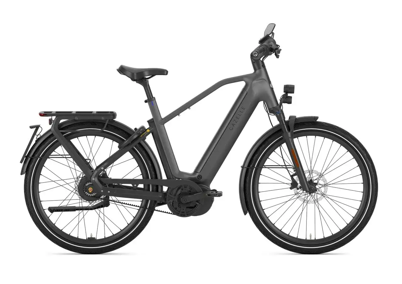 Szary rower elektryczny Gazelle z bagażnikiem i oświetleniem, jeden z najszybszych rowerów elektrycznych na rynku.