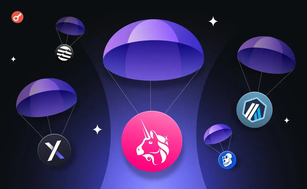 Co to jest airdrop kryptowaluty? Ilustracja pokazuje kilka tokenów kryptowalutowych spadających na spadochronach, symbolizując darmowe rozdawanie cyfrowych aktywów.