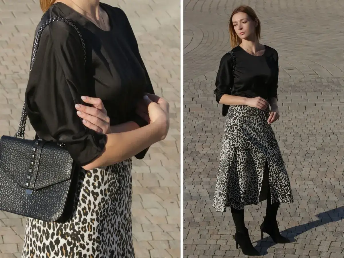 Czarna bluzka i torebka to idealna odpowiedź na pytanie, co założyć do spódnicy w panterkę. Stylowy zestaw na co dzień.