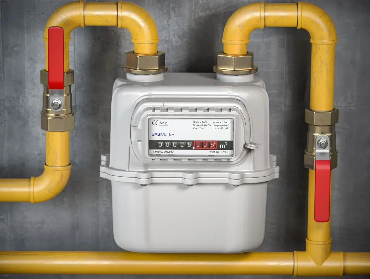 Biały licznik gazowy z żółtymi rurami i czerwonymi zaworami. Pytanie "co ile lat wymienia się licznik gazowy" jest kluczowe dla bezpieczeństwa.