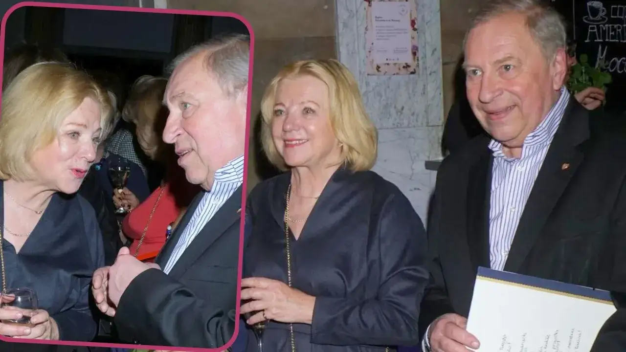 Barbara Stuhr w rozmowie z mężczyzną, oboje z kieliszkami w dłoniach.