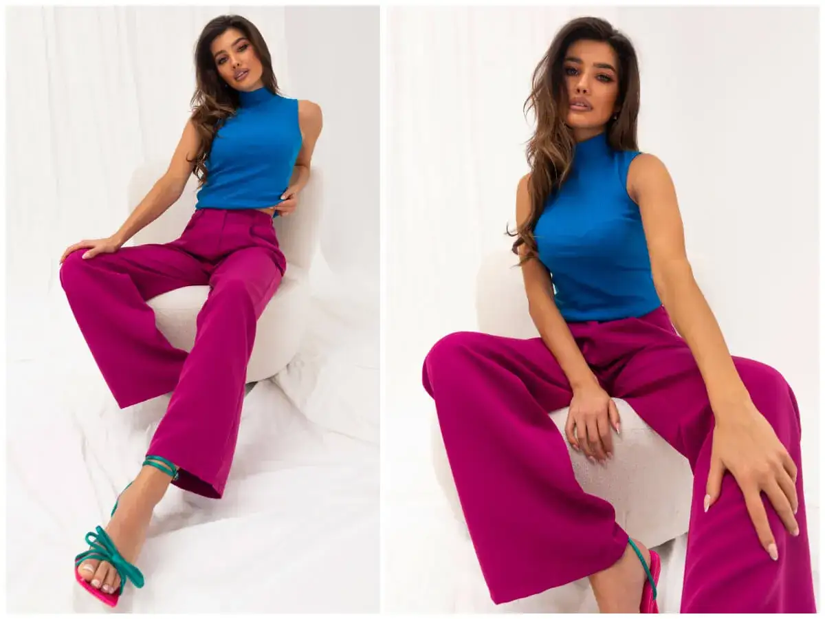 Eleganckie, szerokie spodnie w kolorze fuksji to idealna propozycja, co pasuje do niebieskiej bluzki. Całość dopełniają zielone sandałki.