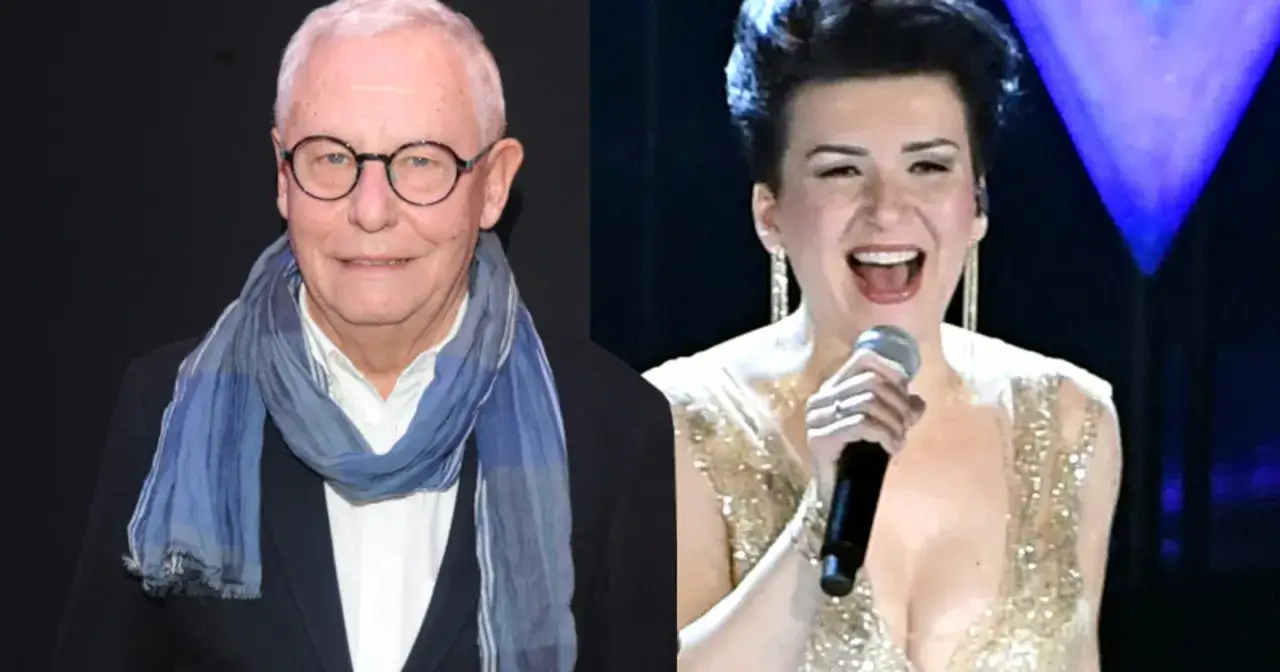 Mężczyzna w okularach i szaliku obok kobiety, która śpiewa "Mam tę moc".