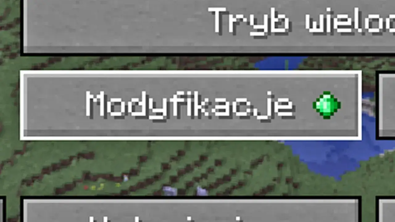 Ekran gry Minecraft z przyciskiem "Modyfikacje" i zielonym szmaragdem.