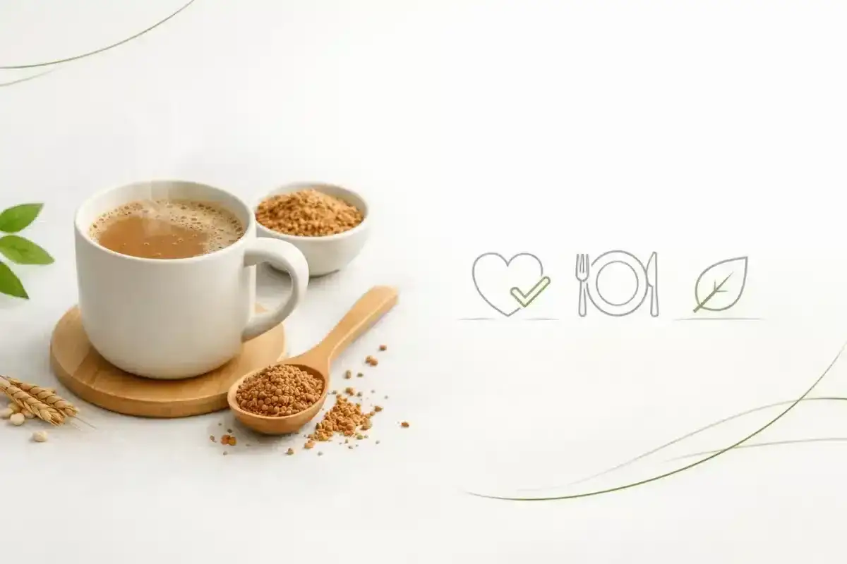 Kubek Inki z ziarnami i łyżką, symbolizujące, czy kawa inka jest zdrowa. Obok ikony serca z zaznaczeniem, talerza z sztućcami i liścia.