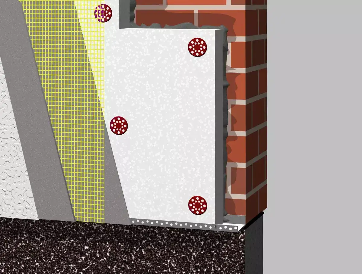 Warstwa styropianu z siatką i listwą startową do termoizolacji budynku.