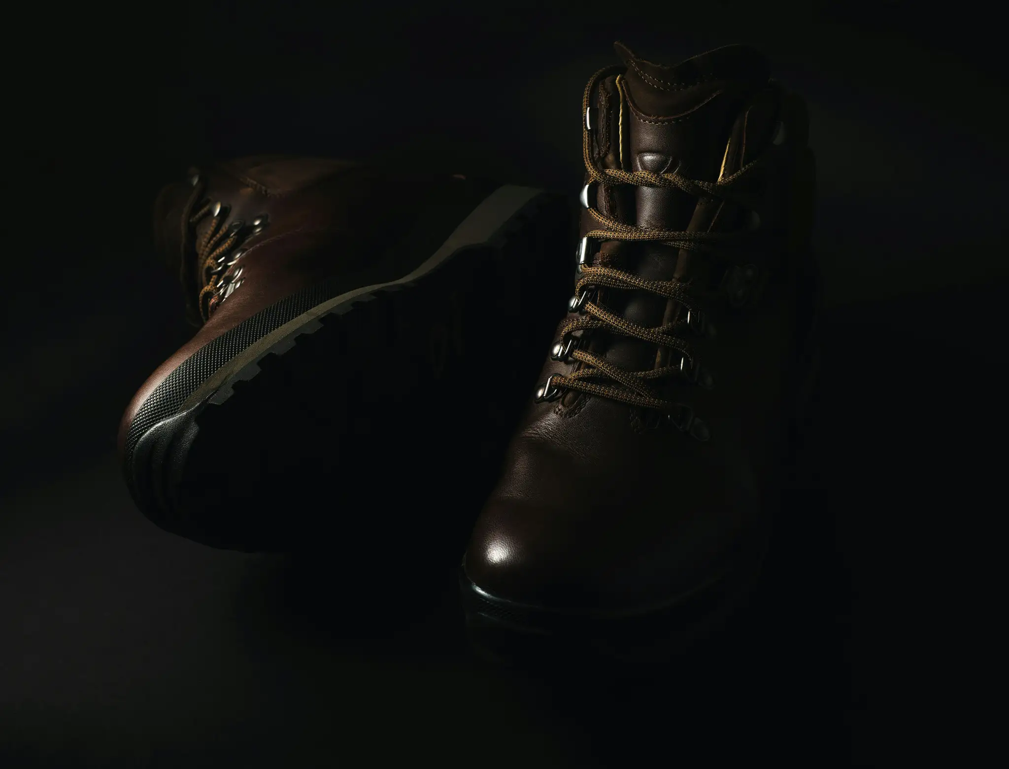 pair of brown leather lace-up combat boots