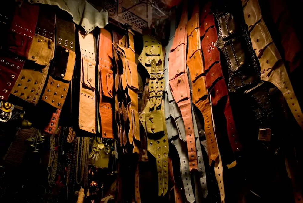 assorted-color leather belt lot being displayed