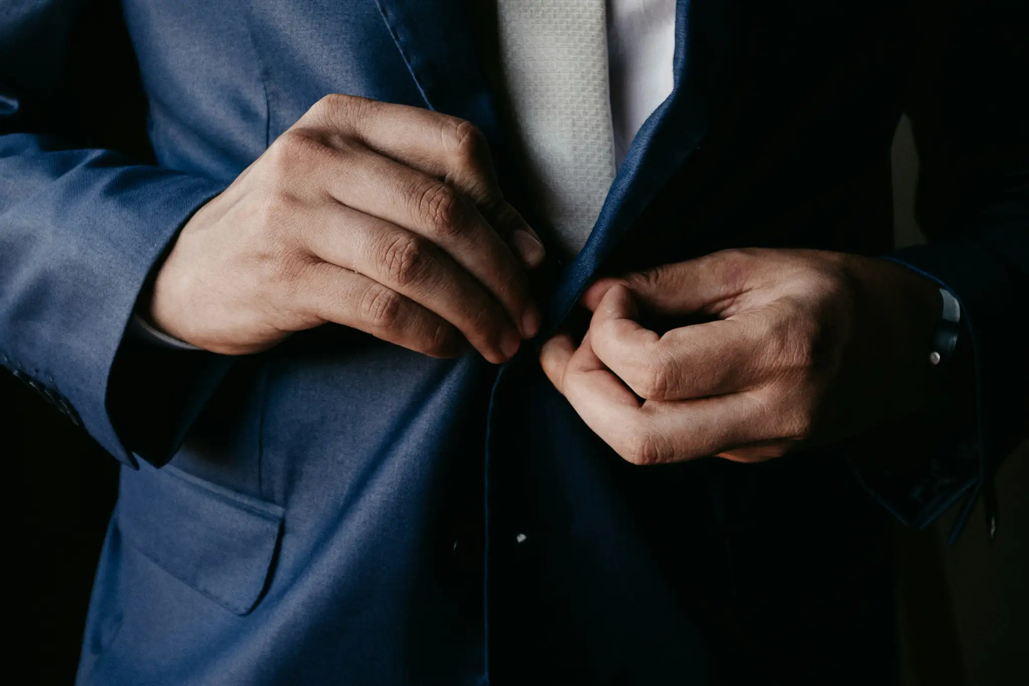 man in blue suit jacket