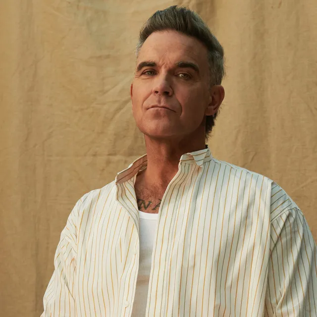Robbie Williams • Albumy • Piosenki • Życiorys