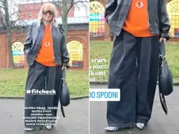 Kobieta w pomarańczowym swetrze, czarnej ramonesce i szerokich, szarych sztruksach. Stylizacja #fitcheck.