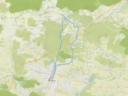 Mapa z zaznaczonymi ścieżkami rowerowymi w okolicach Kielc, prowadzącymi przez tereny zielone i miejscowości.