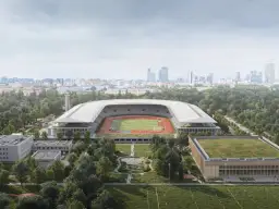 Nowoczesny stadion lekkoatletyczny z bieżnią i boiskiem, otoczony zielenią, w tle panorama miasta. To przyszłość Agrykoli.