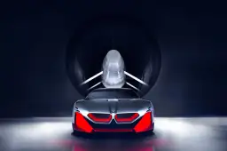 Przyszłościowy koncept BMW M9 w tunelu aerodynamicznym, z agresywnym przodem i czerwonymi akcentami.