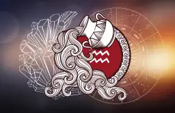 Symbol **Wodnik** w postaci dzbanka z wodą, otoczony kryształami i kołem zodiaku.