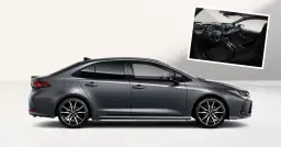 Szary sedan Toyota Corolla z widokiem wnętrza. Elegancki design i nowoczesne technologie.