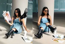 Chica con gafas de sol y jeans anchos, luciendo unas **botas en verano** mientras lee una revista junto a un café.