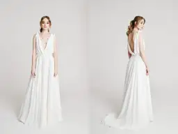 Elegancka, biała suknia ślubna z głębokim dekoltem i odkrytymi plecami. Zastanawiasz się, ile kosztuje uszycie sukni ślubnej?