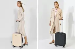 Dwie kobiety z walizkami podróżnymi na białym tle.