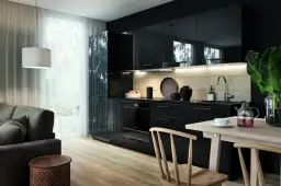 Jak urządzić salon z aneksem kuchennym 30m2, aby zyskać przestronność?