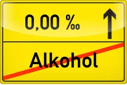 Żółty znak drogowy z napisem "0,00 % Alkohol" i przekreśleniem.
