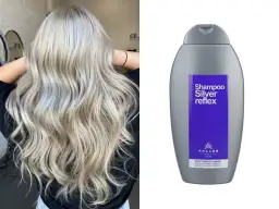 Efekt po użyciu fioletowego szamponu: piękne, lśniące blond włosy. Obok butelka szamponu Kallos Silver Reflex.
