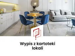 Nowoczesna kuchnia i salon z granatowymi krzesłami, złotym stołem i sofą. Wypis z kartoteki lokali.
