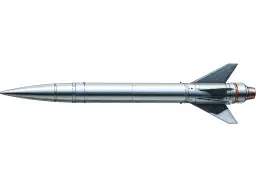 Srebrzysta rakieta, czyli missile po polsku, z ostrym stożkiem i trójkątnymi stabilizatorami, gotowa do startu.