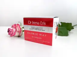Dr Irena Eris Clinic Way dermokapsułki rewitalizujące. Pudełko z kosmetykiem i różowa róża.